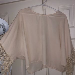 Cream blouse with tasseled sleeves